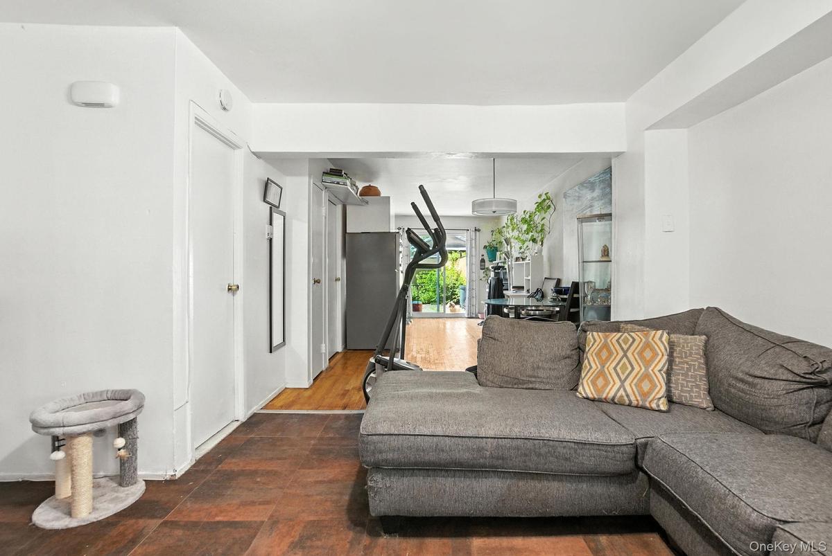 Living room featuring dark wood-style floors