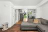Living room featuring dark wood-style floors