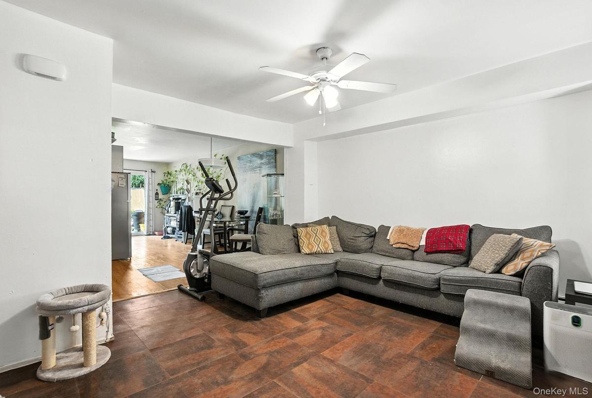 Living area featuring a ceiling fan