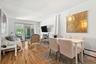 Dining space with hardwood / wood-style floors