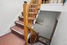 Staircase featuring carpet