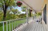 Enjoy summer nights on the expansive front porch with seasonal views of Lake Meahagh!