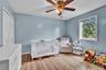 Wood-finish flooring complementing light blue walls