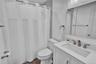 Bathroom featuring a single vanity with an integrated sink, brushed nickel faucet, and a wall-mounted medicine cabinet