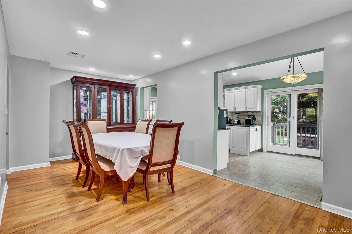 Wood-finish flooring throughout, complemented by recessed lighting