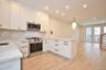 Another view of the kitchen looking into living room with Juliet balcony.