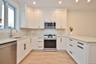 Designer kitchen with quartzite countertops, & stainless-steel appliances