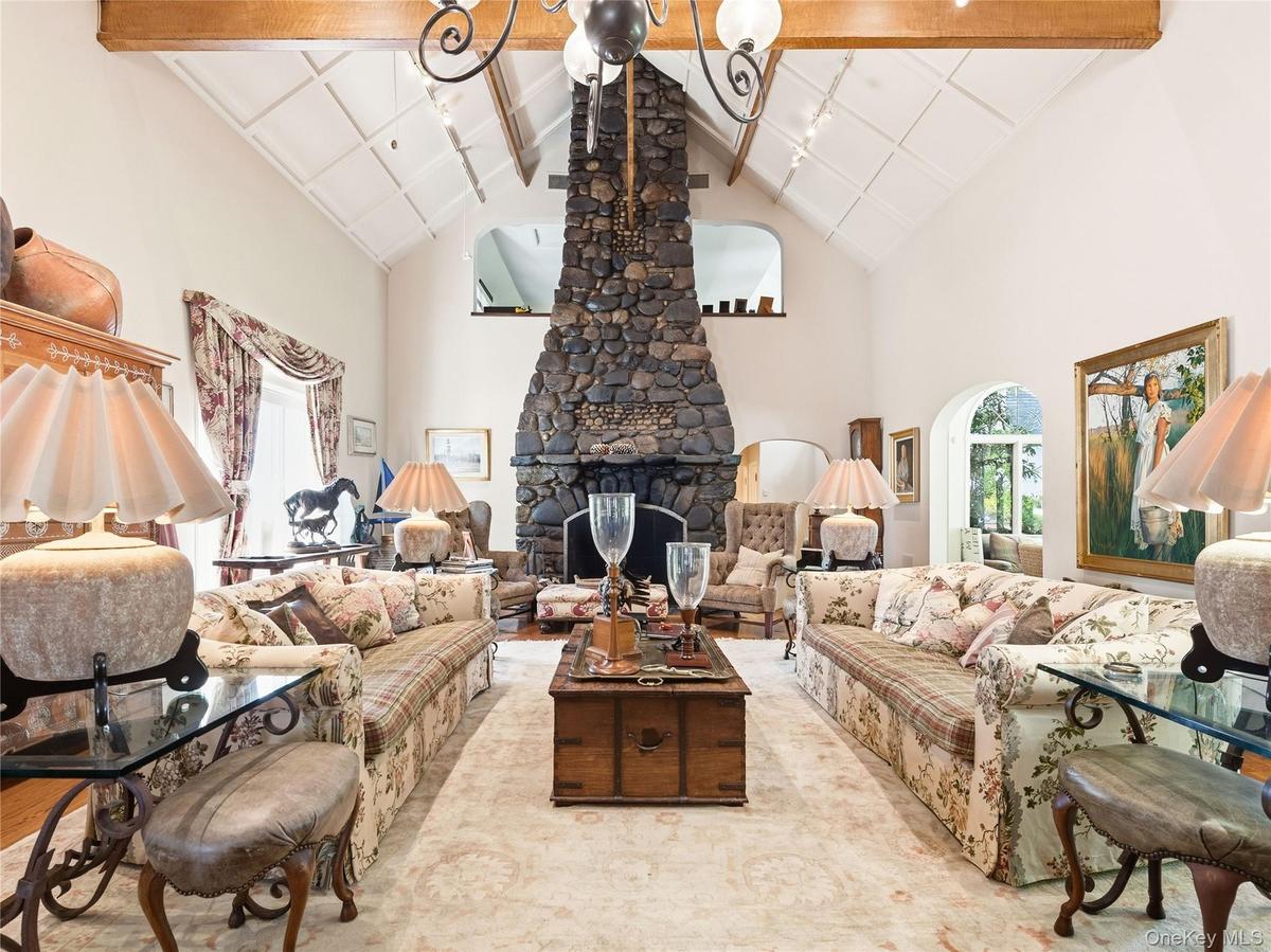 Formal Living Room with Dramatic Two-Story Stone Fireplace