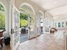 Expansive Sunroom Overlooking the Lush Yard