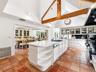Custom Chef’s Kitchen with Vaulted Ceilings and Skylight