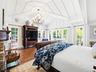 Primary Bedroom with Pool Views and Direct Pool Access via French Doors