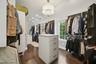Primary Walk in closet w/ W/D