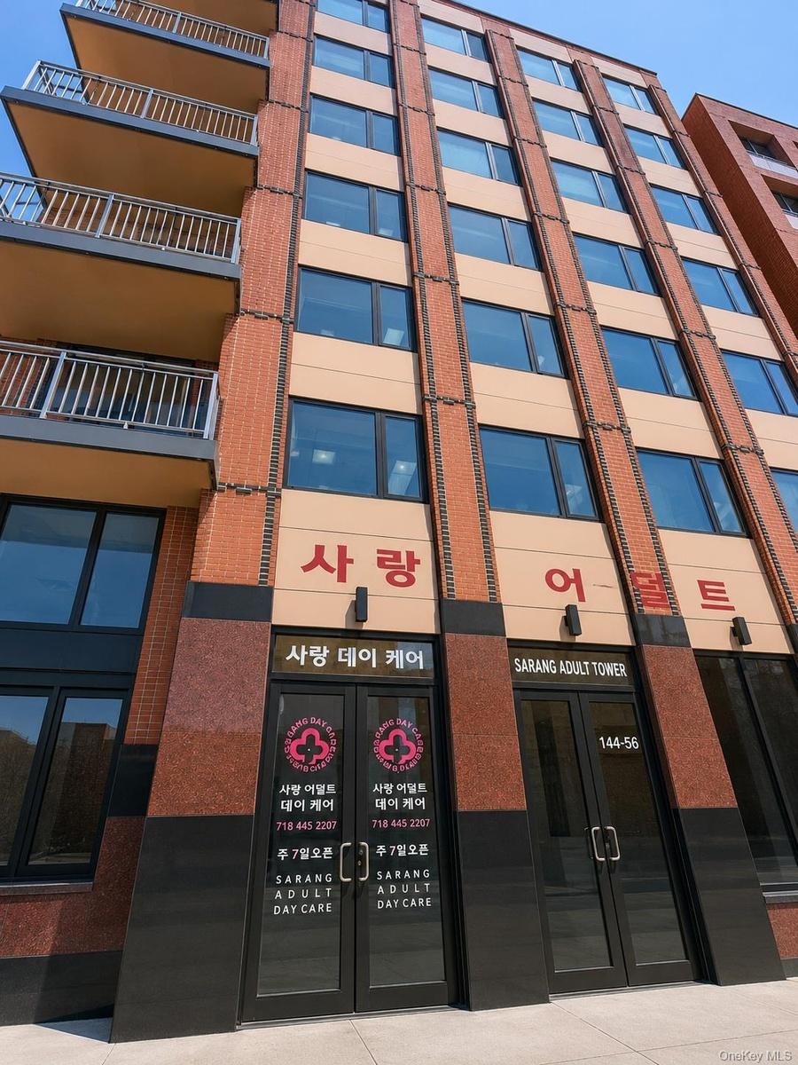 Multistory building with a brick and tan facade