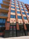 Multistory building with a brick and tan facade