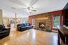 Wood fireplace with masterful stone mantle and setting
