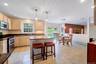 Center Island, custom lighting and tiled floor