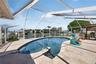 Sparkling blue water with swim up bench
