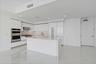 All Jenn-Air Kitchen & Custom upgraded high gloss cabinetry with matching refrigerator door panels