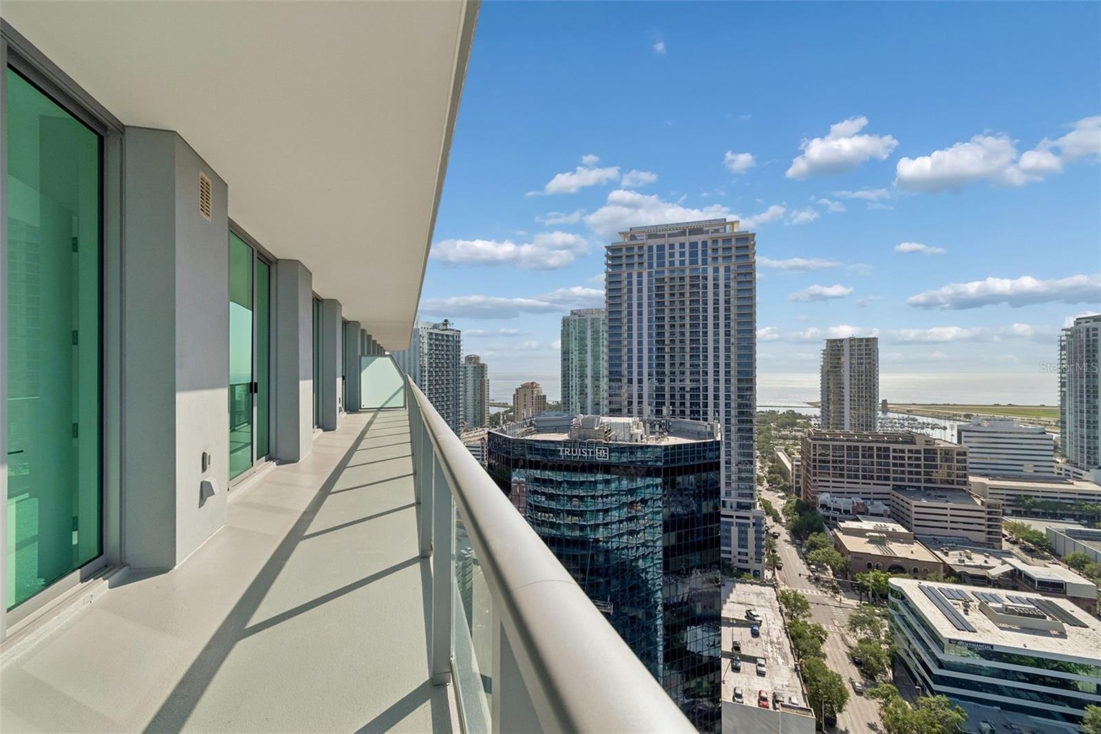 60 ft balcony runs the full length of condo with views of both city and bay