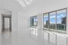 28' Great room has multiple sliders to the balcony