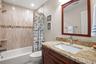 Ensuite bath in second bedroom with tub/shower combination