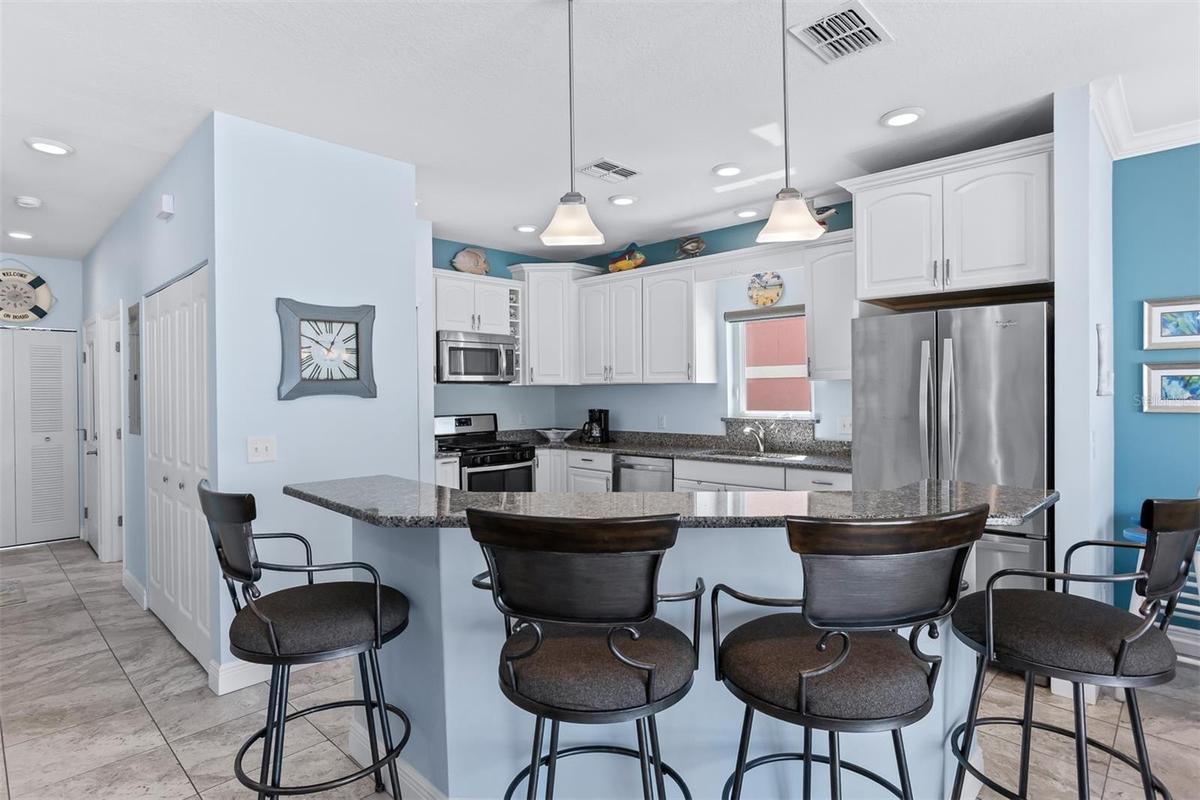 Open concept kitchen, dining and living room