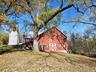 View of barn with a lawn