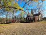Back of Stone House w/ small shed