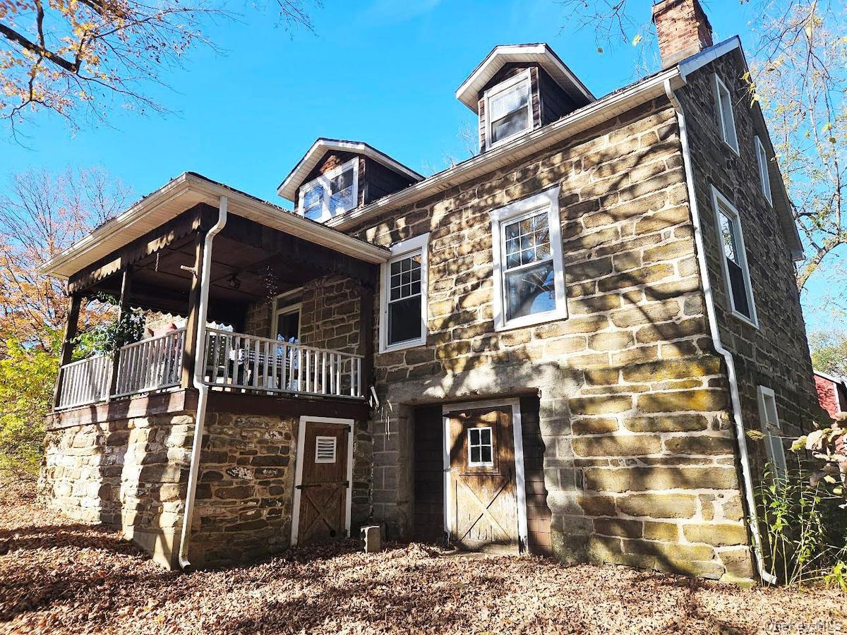 Stone House, front porch, basement entrance & door to storage room under porch