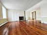 Living Room in Stone House, Natural wood floors & fireplace
