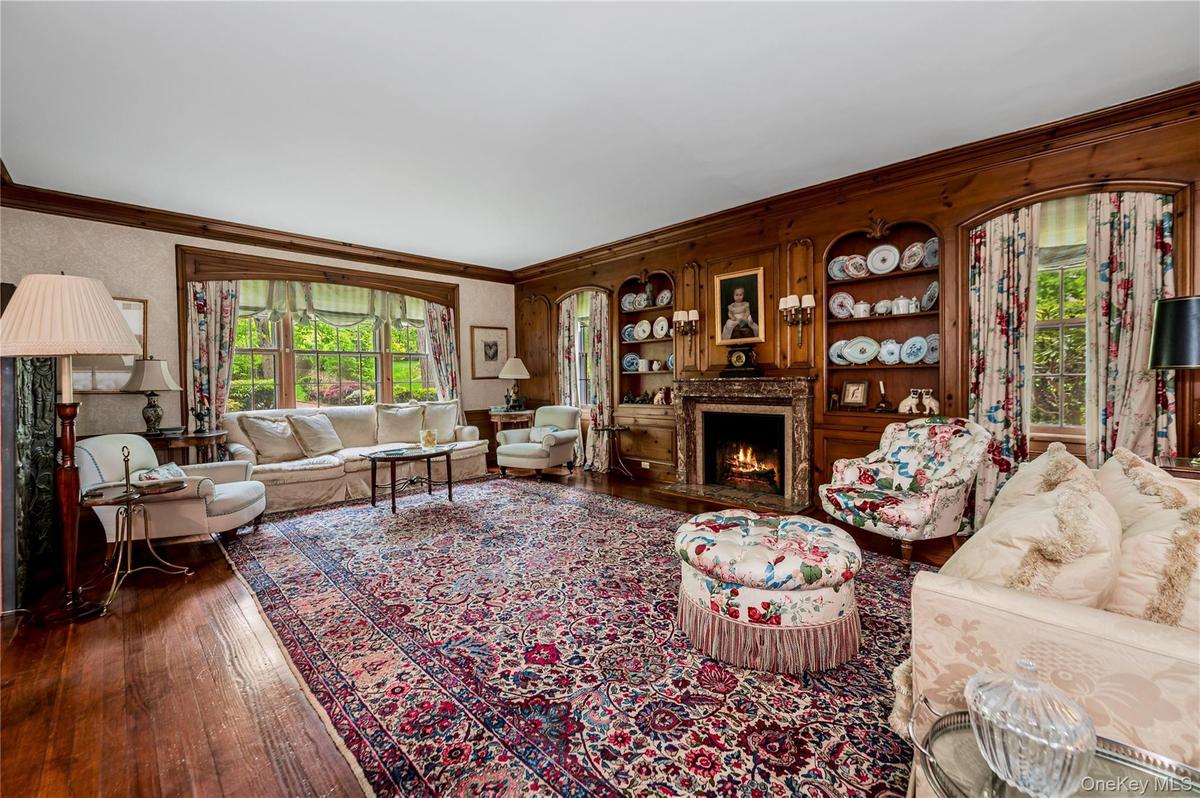 Formal living room with wood burning fireplace