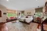 Primary suite with full bath and 4 closets (2 walk in)
