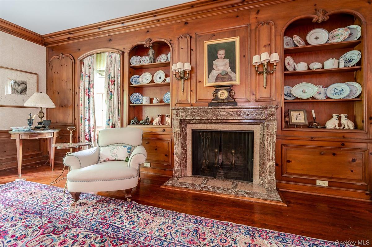 Formal living room with wood burning fireplace