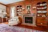 Formal living room with wood burning fireplace