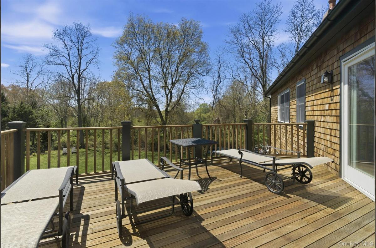 Spacious outdoor deck with natural wood planks and matching railings