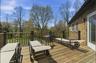 Spacious outdoor deck with natural wood planks and matching railings