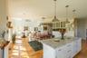 Great room view, combining kitchen, dining room, and living room