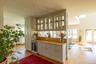Wet bar with beverage fridge and glass cabinets