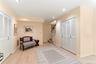 Finished lower level family room/guest quarters with walk-out to parking.