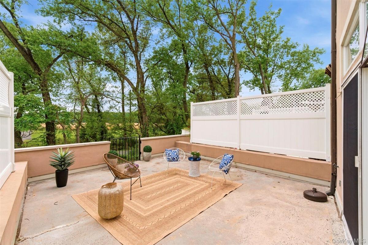 Spacious deck with seasonal views of the Hudson River & Piermont Sanctuary.