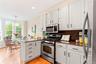 Eat-in Kitchen with stainless steel appliances and granite counters.