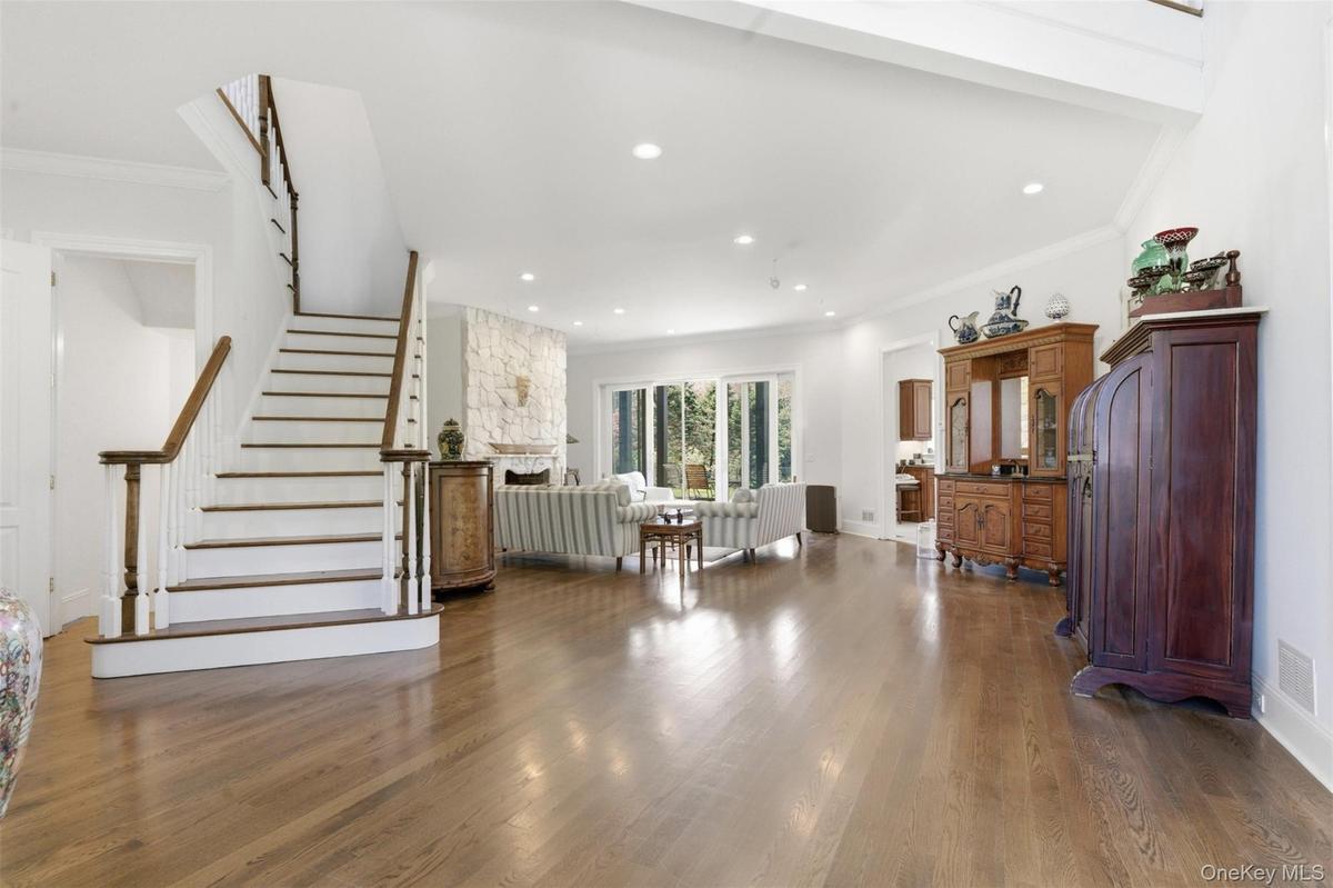 Spacious interior featuring wood-finish flooring and white walls