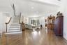Spacious interior featuring wood-finish flooring and white walls