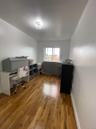 Office space with wood finished floors and baseboards