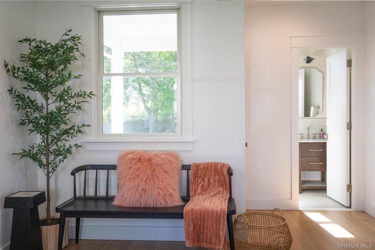 White Oak Floors and oversized windows brings a modern design and natural light to the interior design and how the morning light moves through the hou