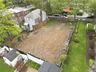Cleared lot featuring fencing on three sides