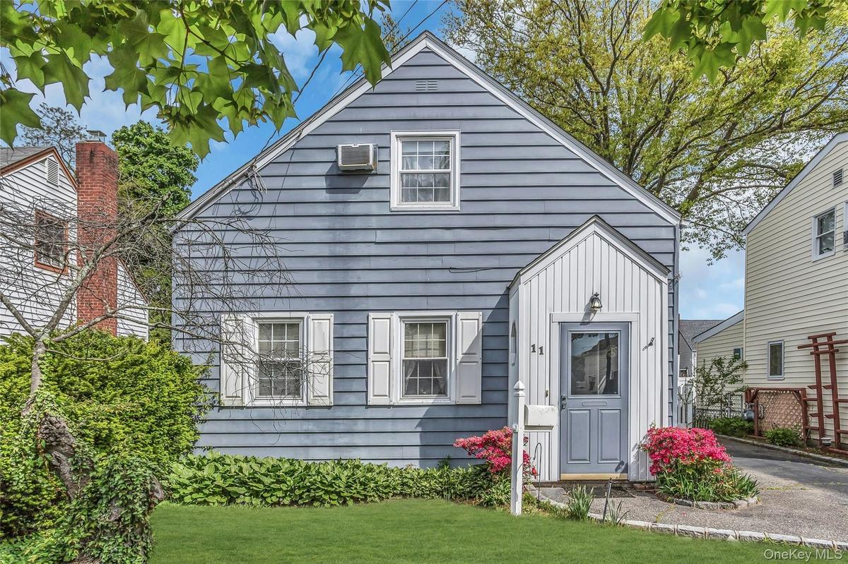 Charming Cape Cod located in the heart of the Motts Creek section of Valley Stream