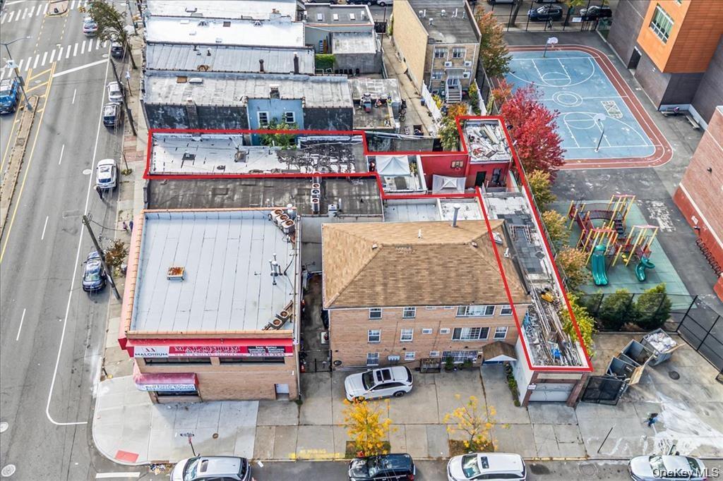 Aerial view of property and surrounding area featuring property parcel outlined
