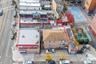Aerial view of property and surrounding area featuring property parcel outlined