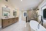 2nd floor full bath with large walk in shower, double vanity and free standing tub